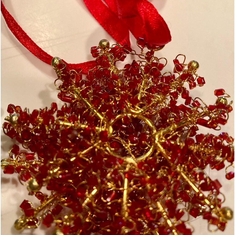 Snowflake ornaments: red, green, gold and silver. 8 total, 2 each color.